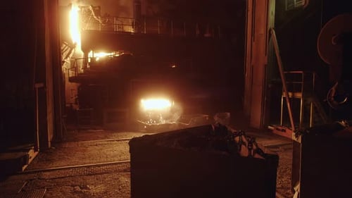 Sparks from the furnace of a metallurgical plant, flashing fire