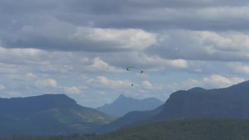 Pilot Paragliding Over Rosins Lookout Forest And Mountain Range At Beechmont - Scenic Rim Region, Qu