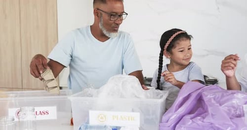 Family Soring Recycling at Home Together