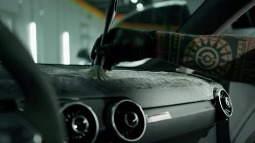 Hand Detailing Car Interior with Brush