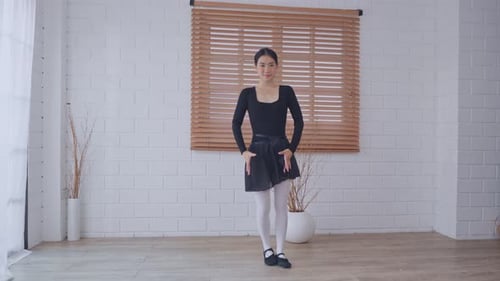 Ballet Dancer Practicing Gracefully in Bright Studio