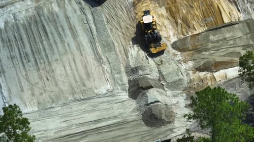 Groundwork Moving Tractor Preparing Place for Future House Foundation Construction