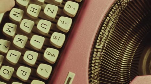 Hands of Novelist Typing Text with Analog Typewriter