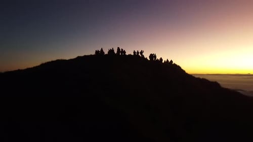 Aerial video of Mount Pulag at sunset with people in the background, the third highest mountain