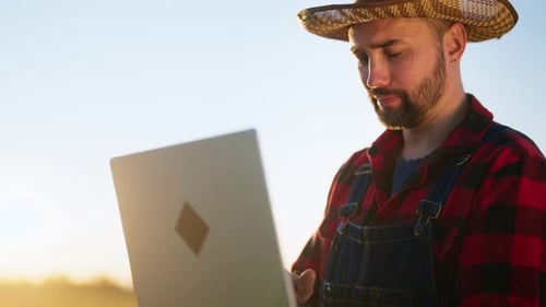 Modern Technology in Agriculture and Agribusiness Farm Worker with Laptop Portrait of Handsome Male