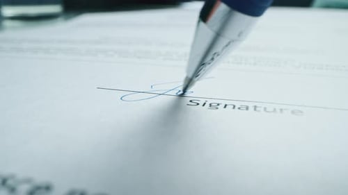 Signing Important Contract With Blue Ink Pen