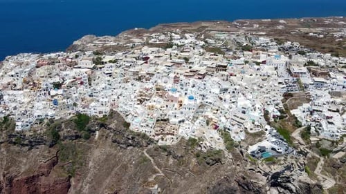 Oia on the Greek island of Santorini captured from above with a drone