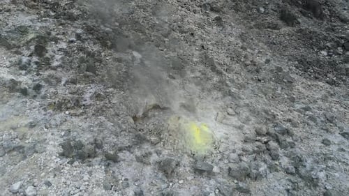 Drone view of natural vents of Mount Sibayak volcano, each releasing thick streams of smoke