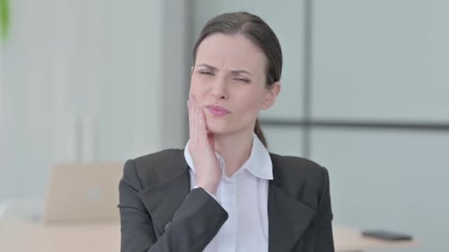 Portrait of Businesswoman having Toothache, Pain