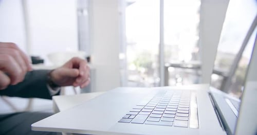 4k video footage of a businessman using his laptop at the office