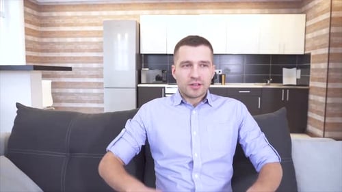 Man Relaxing on Couch in Modern Home