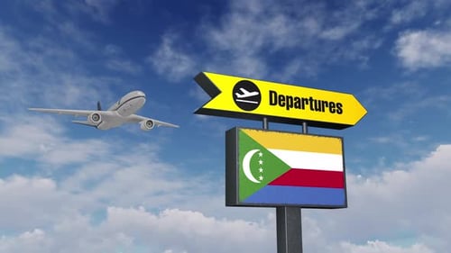 Das Flugzeug fliegt über dem Abflugschild und der Flagge der Komoren