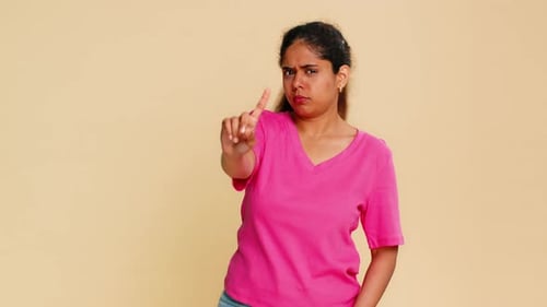 Woman Gesturing No with Finger, Body Language Rejection