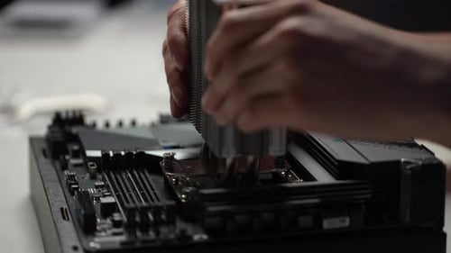 Closeup Cropped Shot of Unrecognizable Repairman Installing New PC CPU Air Cooling System Radiator