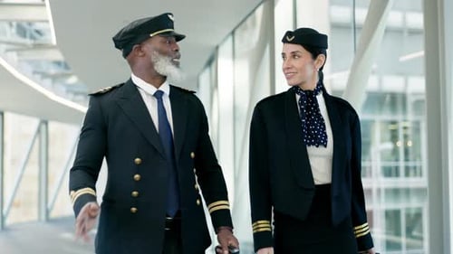 Travel, pilot and air hostess talking at the airport before boarding a flight in the city