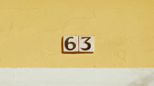 Number 63 (sixty-three) Affixed to a Building