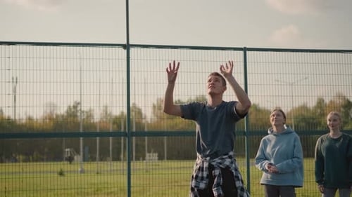 Young Adults Playing Volleyball in an Urban Setting