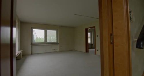 Walking into an old abandoned living room. Room empty and stripped from almost everything. Super