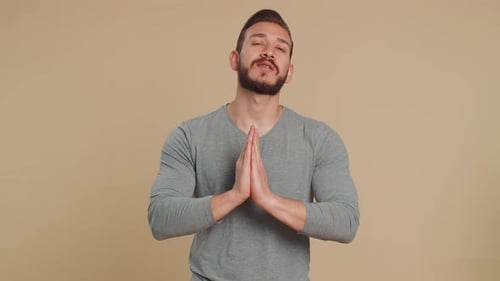 Young Man Giving Advice with Hands Clasped