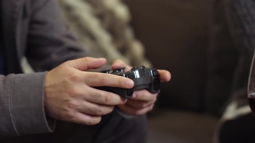 Close Up Man Playing Video Game At Home