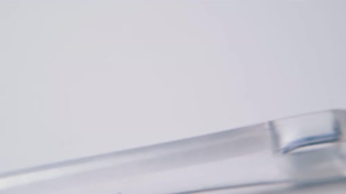 Close Up of Clear Plastic and Red Pastry Brush