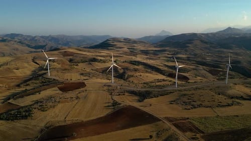 Aerial View of Wind Turbines in Rural Landscape