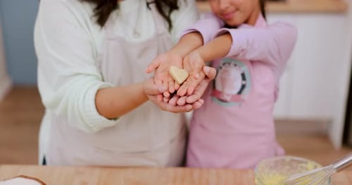 Kitchen hands, heart cookie and family presentation of dessert, candy or sweets shape for love