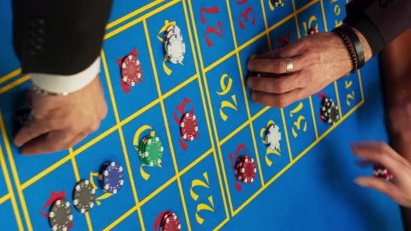 Vertical Screen: Group of Rich Men and Women Gathered Around a Roulette ...