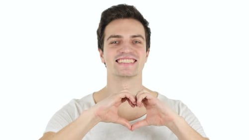 Smiling Man Makes Heart Shape with Hands