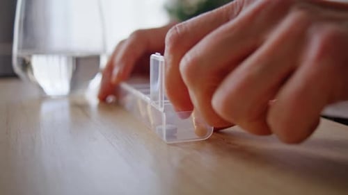 Pills being Taken From Pill Box Close-up