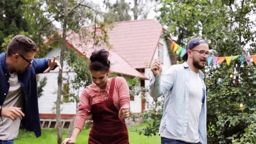 Friends celebrate outdoors with dancing and fun