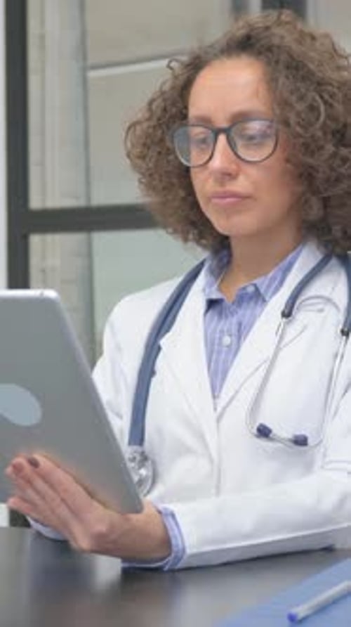 Doctor Uses Tablet Device in Office Setting