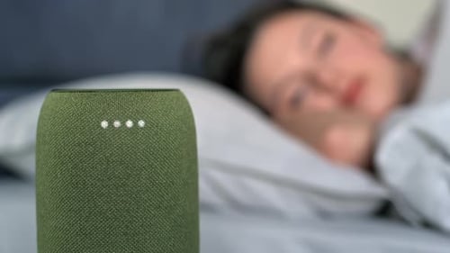 Woman Wakes Up and Taps Smart Speaker