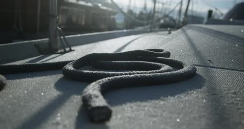 Rope Coil On Sunlit Boat Deck