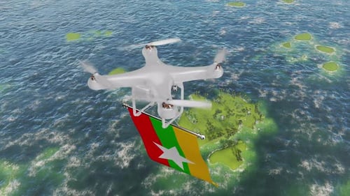 Die Drohne, die mit der Flagge Myanmars über dem Meer fliegt