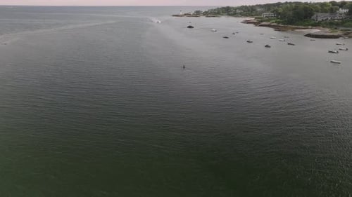 Aerial view of coastline with boats and ocean, United States.