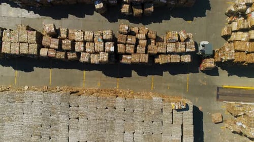 Loader with Waste Paper Drives on Storage Yard Aerial View