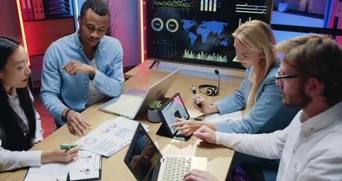 Business Team Meeting with Technology in Modern Office