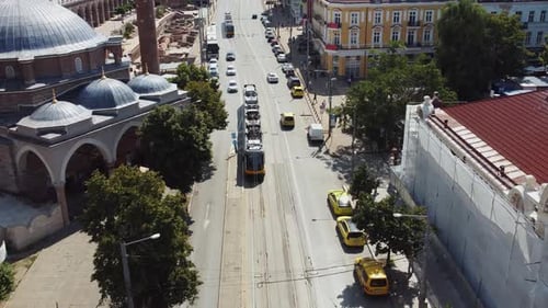 Tram running inside the city aerial