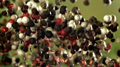 Floating Colorful Peppercorns Close Up Slow Motion