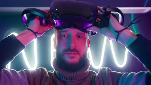 Man Putting on a Virtual Reality Headset