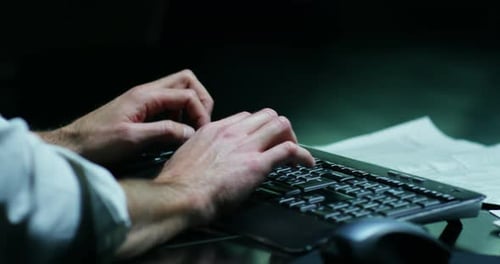 A hand writes a computer keyboard in slow motion. Concept: Technology, keyboards, businessman, imm