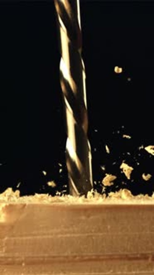 The Drill Drills Wood with Sawdust Filmed is Slow Motion 1000 Fps