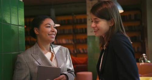 Cheerful Women Office Workers Share Thoughts About Work