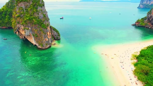 Aerial view from a drone flying over the tropical sea. 4K