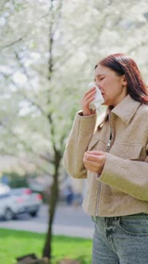 Spring Allergies Cause Discomfort for Woman Outdoors