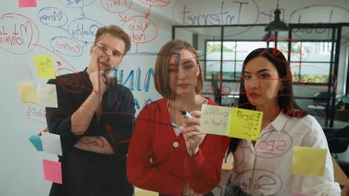 Collaborative Team Brainstorming Together in Bright Modern Office