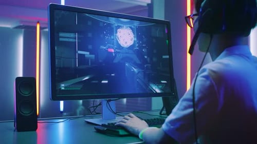 Close-up Shot of Professional Gamer Playing in First-Person Shooter Online Video Game on His Person