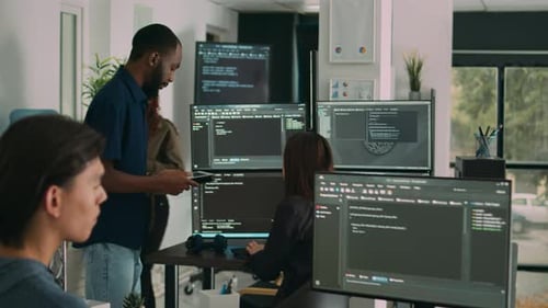 Male Software Developer Typing Machine Learning App Code on Computer