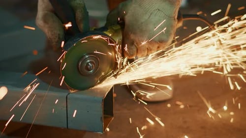Closeup Metal Grinding Sparks Flying From Angle Grinder Gloveprotected Hands Working Slowly